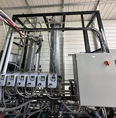 A machine with many wires and cables

AI-generated content may be incorrect.