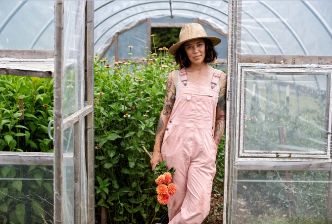 A picture containing clothing, person, greenhouse, fashion accessory

Description automatically generated